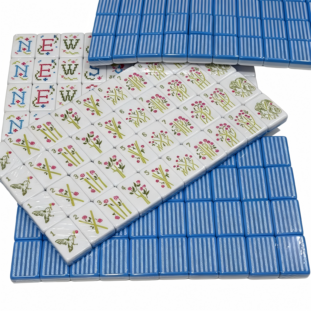 Detailed view of USA Mahjong Co. Sky Linen American Mahjong Set with blue and white striped acrylic tiles and gold inlays.