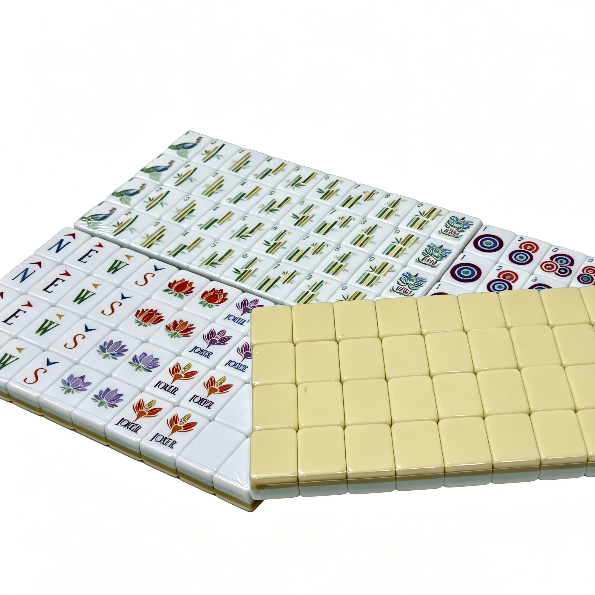 Detailed view of Vanilla Bean Modern American Mahjong Set by USA Mahjong Co. with creamy ivory tiles featuring gold and black inlays.
