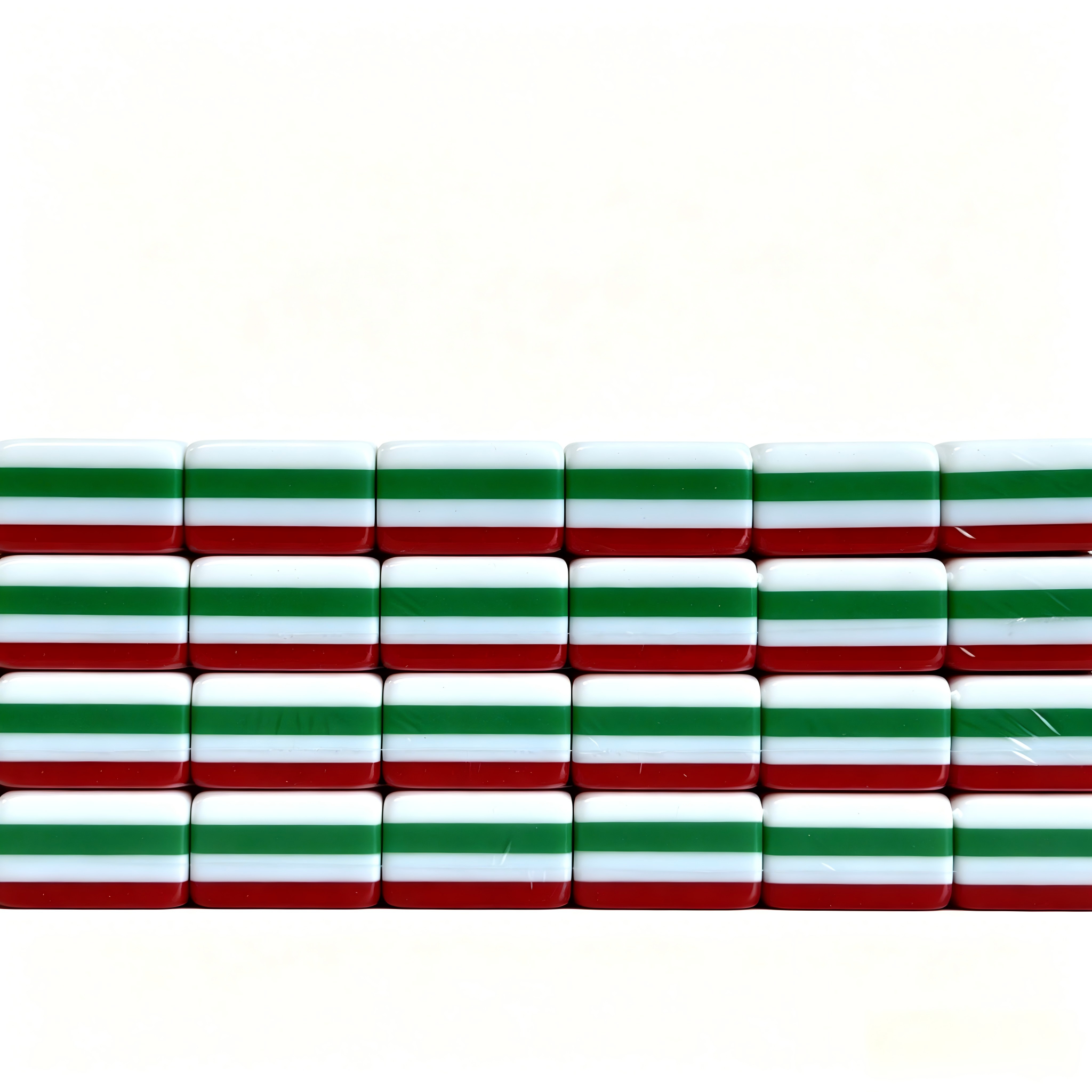 Side profile of 32g Scarlet Empress American Mahjong tiles by USA Mahjong Co., featuring weighted acrylic tiles with bold ruby red backs.