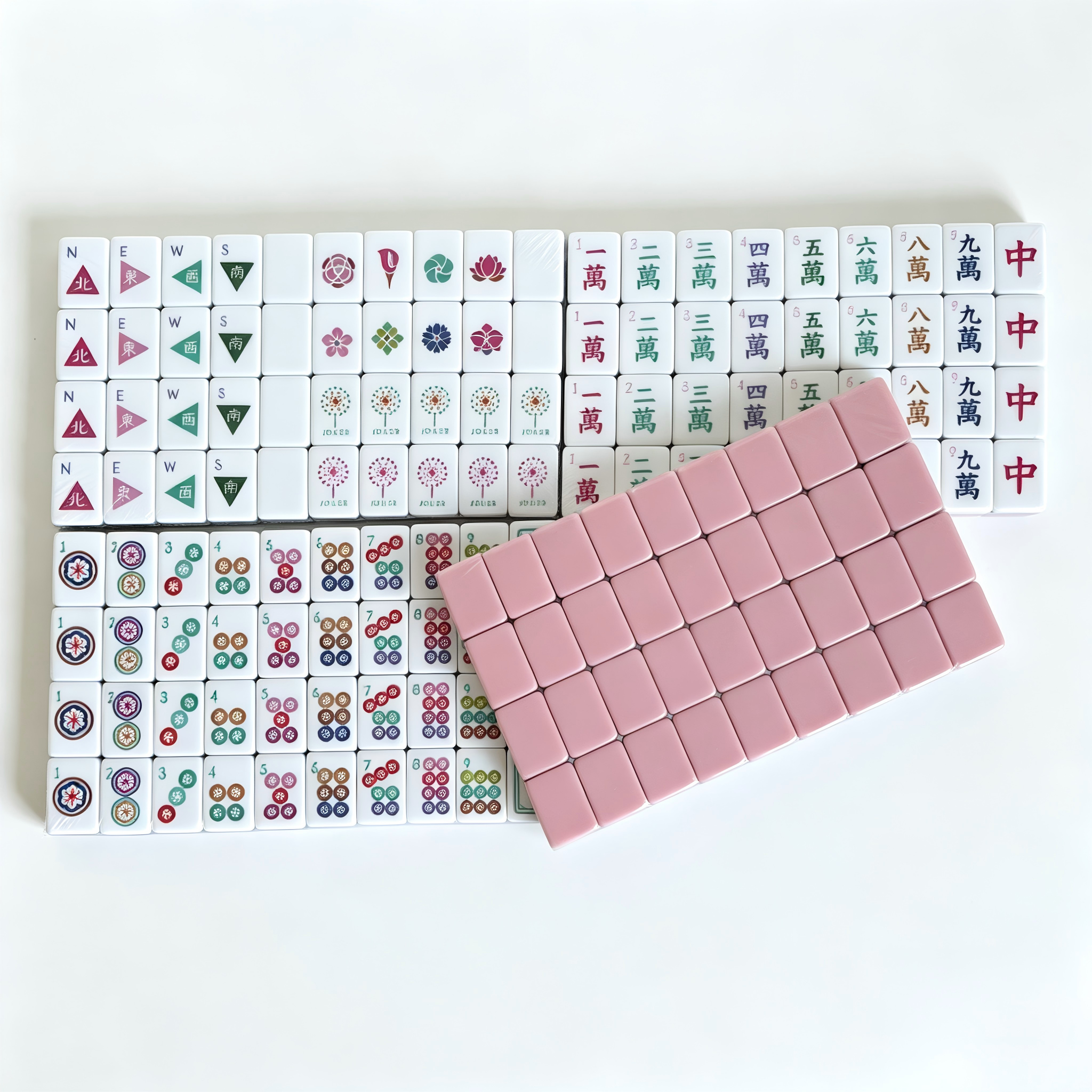 Dusty Rose American Mahjong Set by USA Mahjong Co. with 166 weighted tiles, blush backs, and compass wind design.